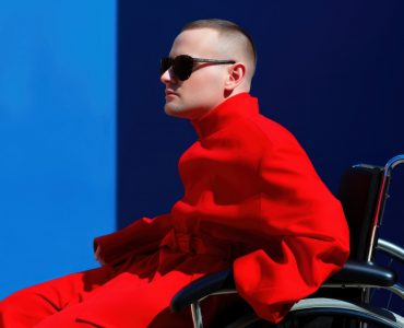 Disability fashion photo wheelchair transportation sunglasses.