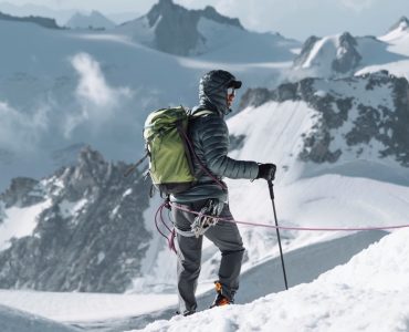 Hiker going up Chamonix Alps in France