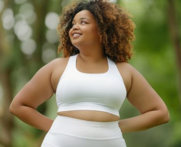 Photo of happy plus size woman wear blank sport spandex *white sportswear mockup*,apparel,fashion, minimal, low detail,at park blur background --style raw --v 6.0 --ar 3:2