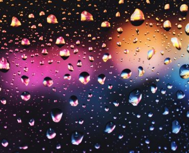 Colorful raindrops on glass