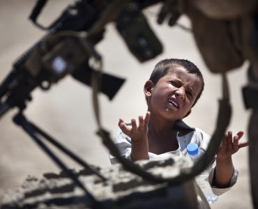 Candy Man

More:

 An Afghan boy petitions Lance Cpl. Christopher Bones, a rifleman with India Company, 3rd Battalion, 3rd Marine Regiment, and 21-year-old native of Brookings, Ore., for candy after receiving a water bottle from another Marine during a security patrol here, April 28, 2012. On the patrol, the Marines gave a battlefield tour of the Safar region to their replacements with Kilo Company, 3rd Battalion, 8th Marine Regiment. After arriving in Helmand province's Garmsir district in October 2011, the 'America's Battalion' Marines are nearing the end of their seven-month deployment. During the deployment, they aided Afghan National Security Forces in assuming lead security responsibility of Garmsir, developing and expanding legitimate Afghan governance by defeating insurgent forces and securing the people of Garmsir.(U.S. Marine Corps photo by Cpl. Reece Lodder). Original public domain image from Flickr