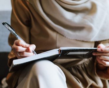 Photo - Woman in a Headscarf Writing