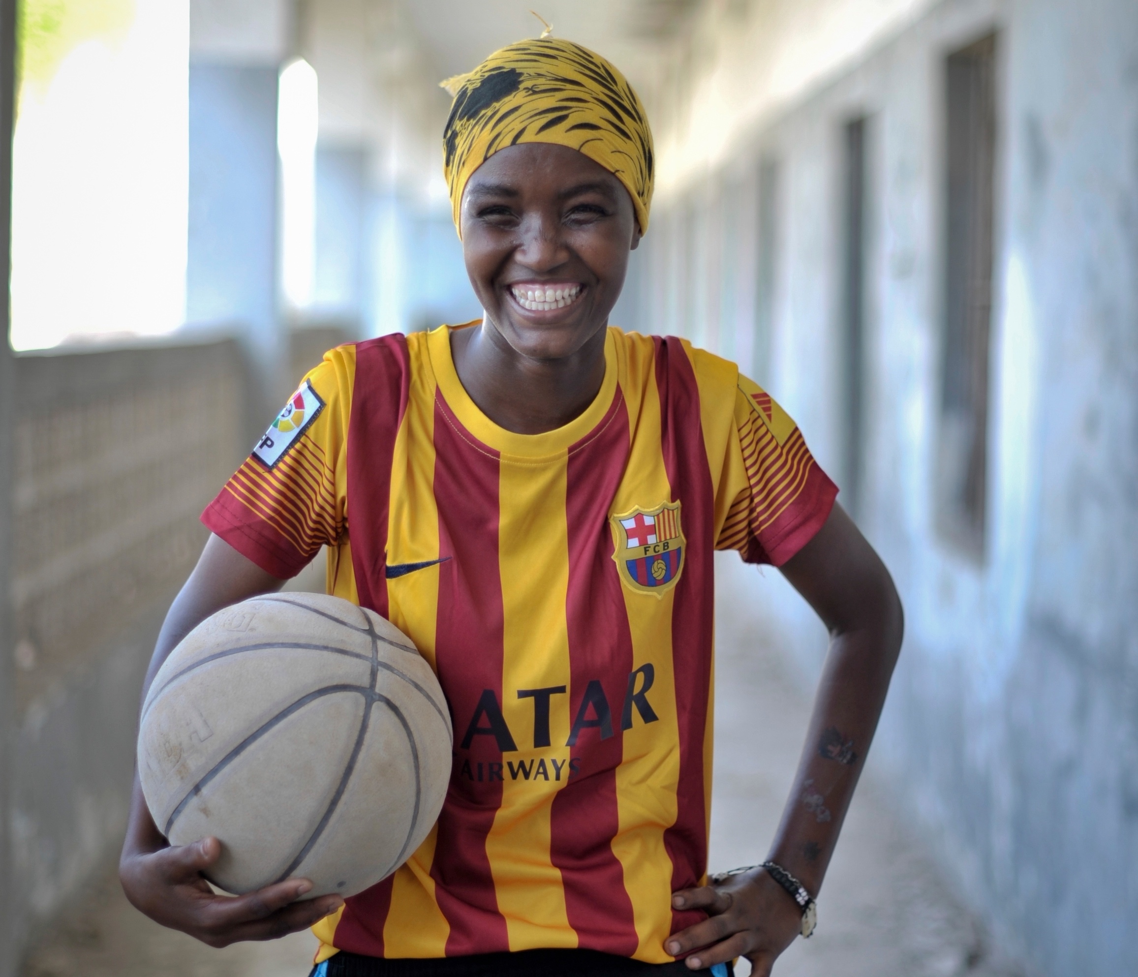 A young Somali girl holds a basketball during a practice session in Mogadishu on June 6. Banned under the extremist group, Al Shabaab, Basketball is once again making a resurgence in Mogadishu. Original public domain image from Flickr

More:

 Today at least a dozen teams in the city play in a league and both men and women are coming out to play the sport. AU UN IST PHOTO / TOBIN JONES. Original public domain image from Flickr