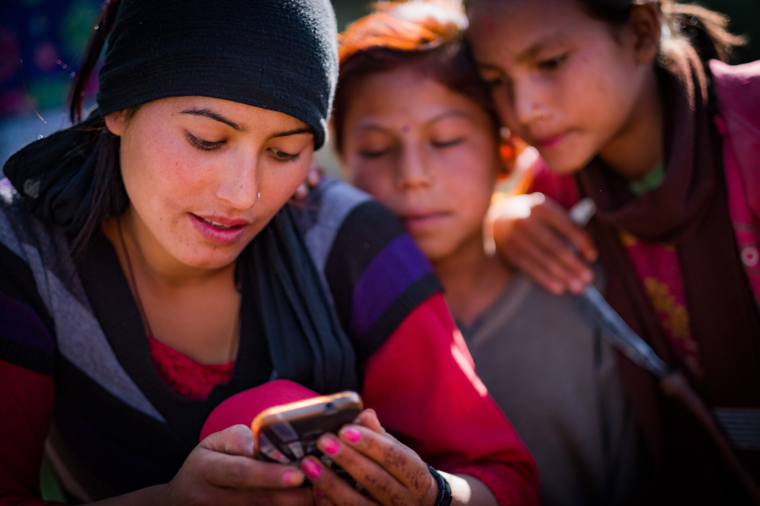 Woman and children looking at phone, Kailah, Bajhang District, Nepal, October 2017.

More:

 Original public domain image from Flickr