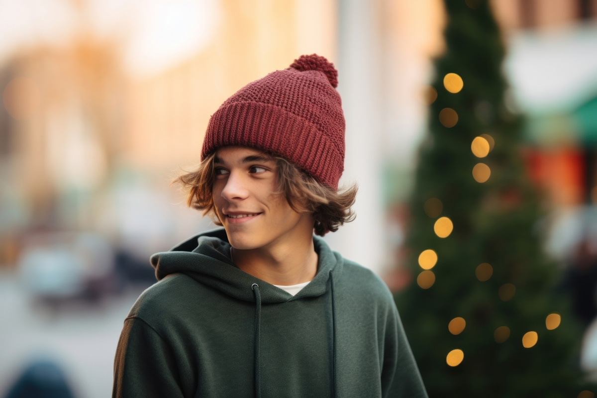 a close up of a person wearing a cotton Beanie, pine color scheme, streetwear holiday vibes, simple, blurred background --ar 3:2